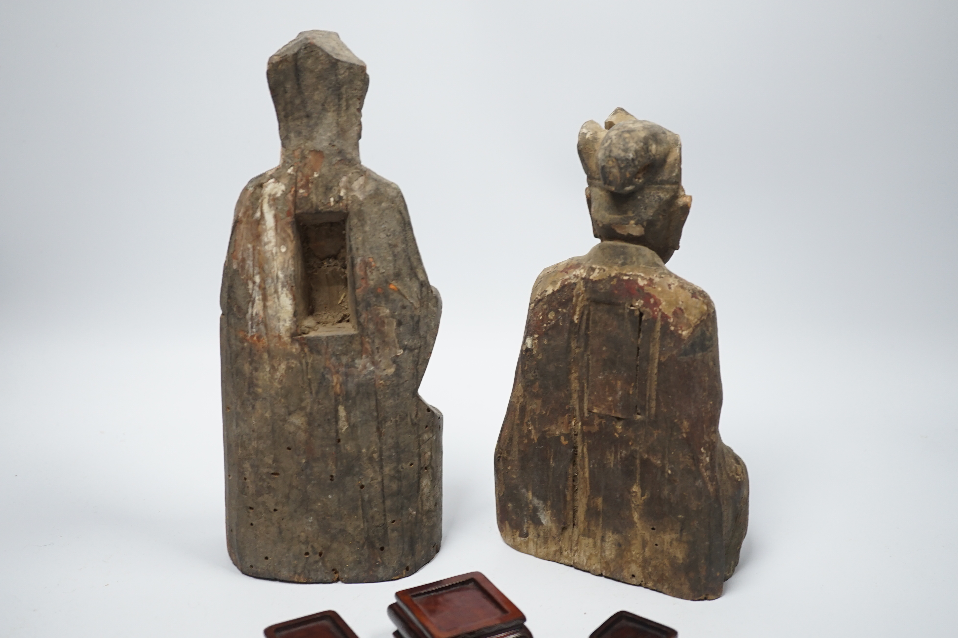 Two Chinese or Southeast Asian carved wood figures of seated immortals, and seven small wood stands, - Image 6 of 6