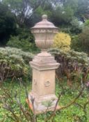 An impressive composition stone vase, raised on tall plinth, overall height 181cm