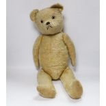 A golden plush bear, worn, 60cm