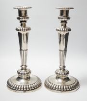 A pair of George III silver candlesticks, on fluted waisted stems, John Roberts & Co, Sheffield,