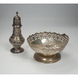 An Edwardian embossed silver sugar caster, Birmingham, 1904, 17.6cm and white metal cake basket