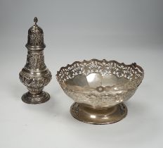 An Edwardian embossed silver sugar caster, Birmingham, 1904, 17.6cm and white metal cake basket