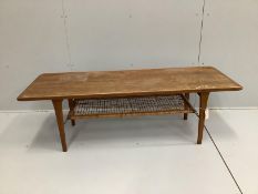 A mid century Danish teak coffee table with a No. 25 stamp underneath, possibly by Hans Wegner,