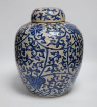 A large 19th century Chinese blue and white crackle-glaze ‘lotus’ jar and cover 32cm