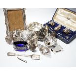 Sundry small silver including a repousse heart shaped trinket box, silver mounted photograph