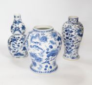 Three 19th century Chinese blue and white vases, each painted with birds, butterflies and flowers,