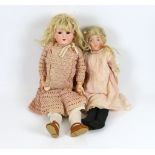 An AM 390 on jointed body with original dress and wig, 50cm, together with an English doll soft