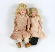 An AM 390 on jointed body with original dress and wig, 50cm, together with an English doll soft
