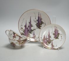 A Japanese eggshell part tea service with wisteria decoration, comprising of eight cups, eleven