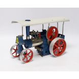 A boxed Wilesco ‘Old Smoky’ live steam traction engine (D40) and two accessories; a circular saw (