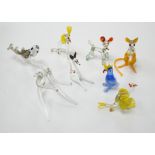 A collection of Murano glass animals including dogs and fish