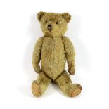 An early German bear, c.1912, black button eyes, 45cm, old repair to paws, good mohair