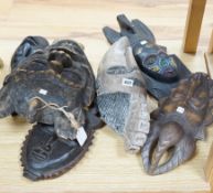 Six assorted carved African tribal masks, including Fang, Ashanti etc. largest 43cms long