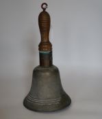 A bronze handbell with wooden handle, 31cm