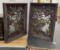 A pair of Chinese polychrome painted pierced rectangular panels, width 58cm, height 80cm