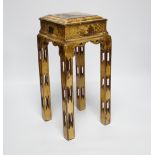 A Chinoiserie japanned stand, 32.5cm high