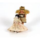 A composition fairy doll, c.1920m 15cm, with a china headed doll on soft body with bisque boots, c.