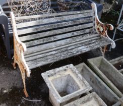 A Victorian style painted cast iron slatted garden bench, length 128cm, depth 68cm, height 78cm