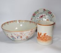 An 18th century Chinese famille rose punch bowl, a similar 'fish' plate and an export mug made for