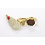 A yellow metal and coral bead mounted carved jade pendant, overall 49mm, a 1970's 18ct gold and