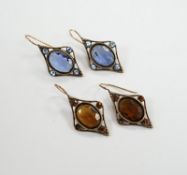 Two pairs of early 20th century gilt metal and coloured paste set drop earrings, overall 37mm.