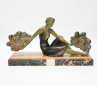 An Art Deco patinated spelter and marble figure, signed A. Leclerc, 40cm wide