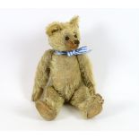 A Farnell bear, c.1912, 33cm, bear paw pads restored, hair loss to stomach