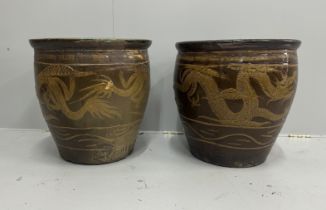 A near pair of Chinese style glazed earthenware garden planters, larger diameter 50cm, height 50cm