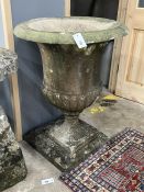 A 19th century carved white marble campana shaped urn, raised on a square plinth, diameter 60cm,