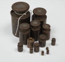 A set of fourteen graduated Avery weights, largest 8cm high