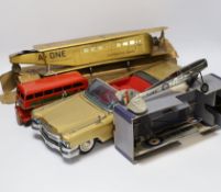 Four tinplate toys; a Frog Interceptor Fighter, a Bandai battery powered Cadillac Convertible (