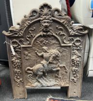 A Victorian cast iron fire back, width 57cm, height 78cm