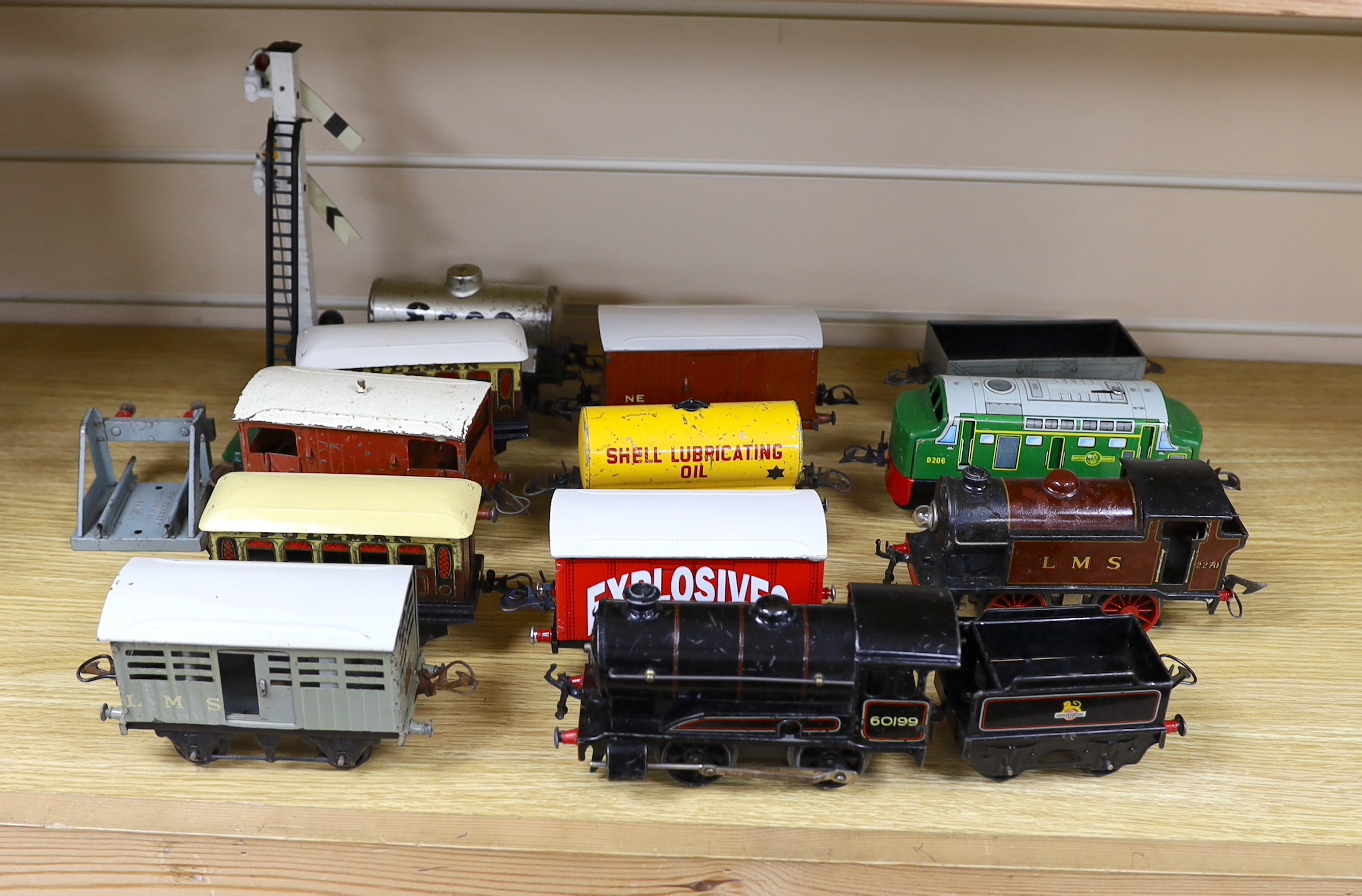 Thirteen Hornby 0 gauge tinplate items including; a clockwork 0-4-0 tender loco, 60199, a 20v