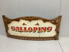 A set of three vintage printed metal 'galloping horse carousel’ fairground boards, each width 170cm,