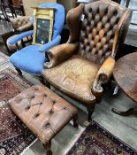 A Victorian style buttoned leather armchair, width 85cm, depth 76cm, height 106cm and a stool