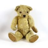 A large 1930's Chiltern bear, 53cm, with replaced nose stitching, some hair loss generally