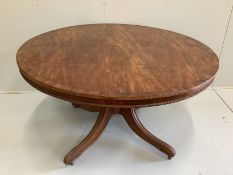 A Regency circular rosewood banded mahogany breakfast table, diameter 130cm, height 70cm