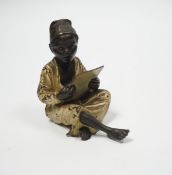 A Viennese cold painted bronze of a boy with book, 8.5cm high