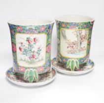 A pair of Japanese porcelain plant pots and stands, early 20th century, 26cm total