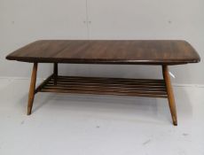 An Ercol rectangular elm coffee table, width 104cm, depth 45cm, height 36cm