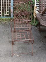 A set of four wrought iron folding garden chairs with seat pads, height 104cm