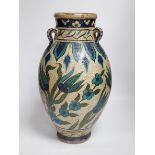 A Persian fritware vase in Iznik style, 40cm high