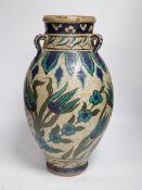 A Persian fritware vase in Iznik style, 40cm high