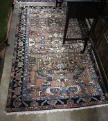 A Hamadan pink ground rug, 220 x 136cm