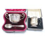 A cased Edwardian silver porringer and spoon, London, 1906 and a cased damaged silver christening