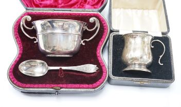 A cased Edwardian silver porringer and spoon, London, 1906 and a cased damaged silver christening