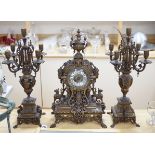 An ornate French bronze clock and five light candelabra garniture, late 19th century, 57cm high