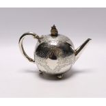 A late Victorian silver bullet shaped teapot, by Atkin Brothers, Sheffield, 1888, with engraved