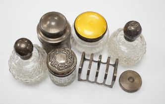 A George V silver tea? cannister, by Mappin & Webb, five silver mounted dressing accessories and a
