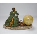 A French Art Deco table lamp a figure of a lady and dog, 29cm wide